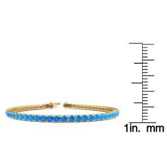 6 3/4 Carat Blue Topaz Tennis Bracelet In 14 Karat Yellow Gold, 9 Inches