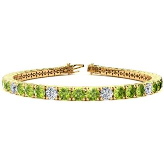 9 1/5 Carat Peridot and Diamond Alternating Tennis Bracelet In 14 Karat Yellow Gold, 7 Inches