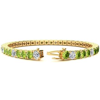 9 1/5 Carat Peridot and Diamond Alternating Tennis Bracelet In 14 Karat Yellow Gold, 7 Inches