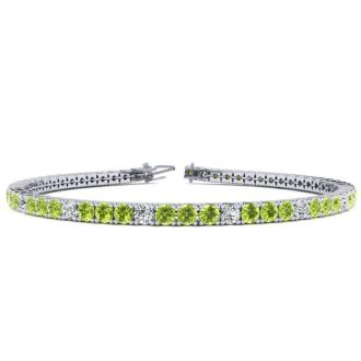 5 Carat Peridot And Diamond Alternating Tennis Bracelet In 14 Karat White Gold, 9 Inches