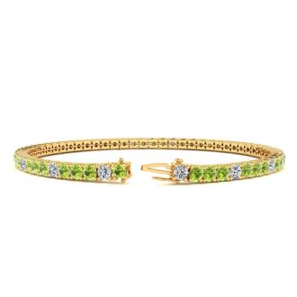 4 1/4 Carat Peridot And Diamond Alternating Tennis Bracelet In 14 Karat Yellow Gold, 7 1/2 Inches