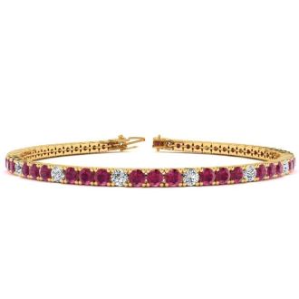 Ruby Bracelet; Ruby Tennis Bracelet; 5 1/2 Carat Ruby And Diamond Alternating Tennis Bracelet In 14 Karat Yellow Gold