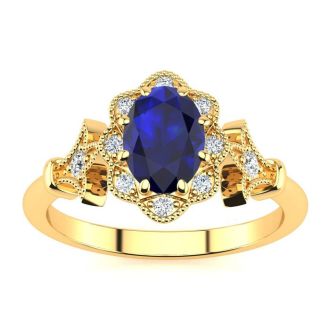 1 Carat Oval Shape Sapphire and Halo Diamond Vintage Ring In 14 Karat Yellow Gold
