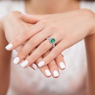 1 Carat Emerald and Halo Diamond Vintage Ring In 14 Karat White Gold