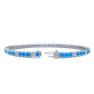 4 1/4 Carat Blue Topaz And Diamond Alternating Tennis Bracelet In 14 Karat White Gold, 8 Inches