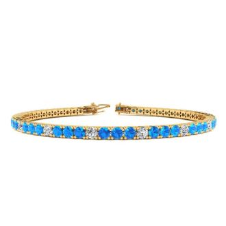 4 Carat Blue Topaz And Diamond Alternating Tennis Bracelet In 14 Karat Yellow Gold, 7 1/2 Inches