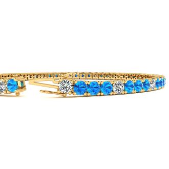 4 1/4 Carat Blue Topaz And Diamond Alternating Tennis Bracelet In 14 Karat Yellow Gold, 8 Inches