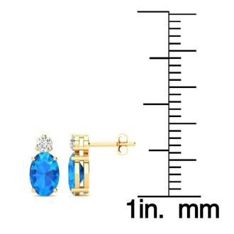 1 Carat Oval Blue Topaz and Diamond Stud Earrings In 14 Karat Yellow Gold