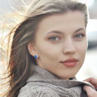 2 Carat Oval Blue Topaz and Diamond Stud Earrings In 14 Karat White Gold