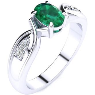 1 Carat Oval Shape Emerald and Four Diamond Ring In 10 Karat White Gold