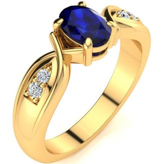 1 Carat Oval Shape Sapphire and Four Diamond Ring In 10 Karat Yellow Gold