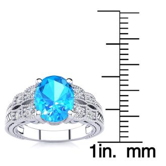 2 1/3 Carat Oval Shape Blue Topaz and Diamond Ring In 10 Karat White Gold