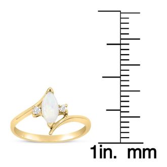 1/2 Carat Marquise Shape Opal Ring and Two Diamonds In 14 Karat Yellow Gold