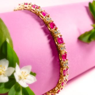 Ruby Bracelet; Ruby Tennis Bracelet; 7 Carat Oval Shape Ruby and Diamond Bracelet In 14 Karat Yellow Gold