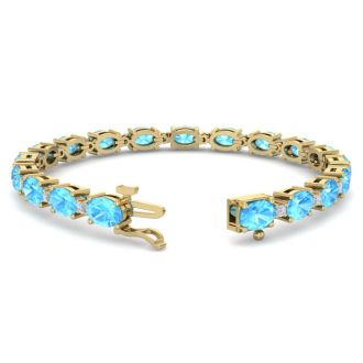 11 Carat Oval Shape Blue Topaz and Diamond Bracelet In 14 Karat Yellow Gold, 7 Inches