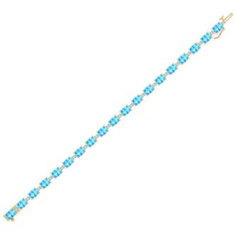 11 Carat Oval Shape Blue Topaz and Diamond Bracelet In 14 Karat Yellow Gold, 7 Inches