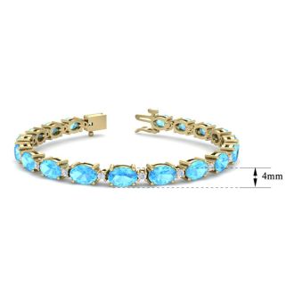 11 Carat Oval Shape Blue Topaz and Diamond Bracelet In 14 Karat Yellow Gold, 7 Inches