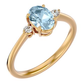 Aquamarine Ring: Aquamarine Jewelry: 1 1/4 Carat Oval Shape Aquamarine and Two Diamond Ring In 14 Karat Yellow Gold