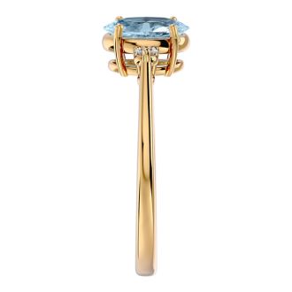 Aquamarine Ring: Aquamarine Jewelry: 1 1/4 Carat Oval Shape Aquamarine and Two Diamond Ring In 14 Karat Yellow Gold