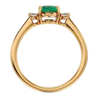 1 1/4 Carat Oval Shape Emerald and Two Diamond Ring In 14 Karat Yellow Gold