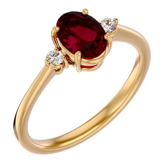 1.65 Carat Oval Shape Ruby and Two Diamond Ring In 14 Karat Yellow Gold
