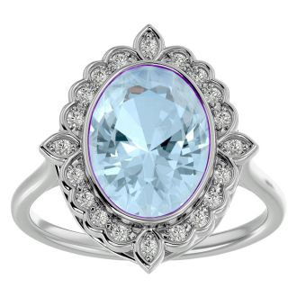 Aquamarine Ring: Aquamarine Jewelry: 1 1/3 Carat Oval Shape Aquamarine and Halo Diamond Ring In 14 Karat White Gold