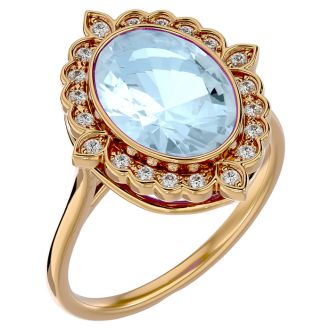 Aquamarine Ring: Aquamarine Jewelry: 1 1/3 Carat Oval Shape Aquamarine and Halo Diamond Ring In 14 Karat Yellow Gold
