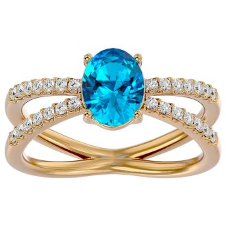 1 3/4 Carat Oval Shape Blue Topaz and Diamond Ring In 14 Karat Yellow Gold