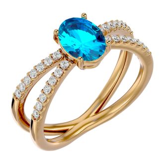 1 3/4 Carat Oval Shape Blue Topaz and Diamond Ring In 14 Karat Yellow Gold