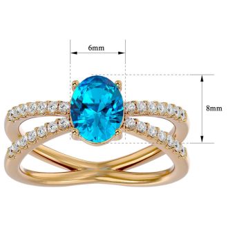 1 3/4 Carat Oval Shape Blue Topaz and Diamond Ring In 14 Karat Yellow Gold