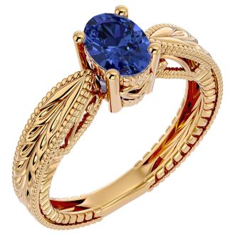 1 1/3 Carat Oval Shape Tanzanite Ring With Tapered Etched Band In 14 Karat Yellow Gold
