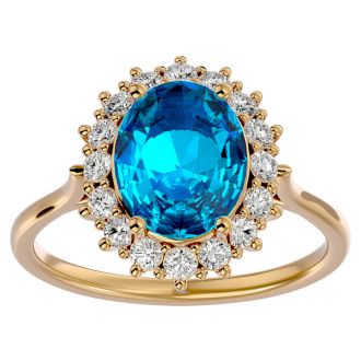 3 3/4 Carat Oval Shape Blue Topaz and Halo Diamond Ring In 14 Karat Yellow Gold