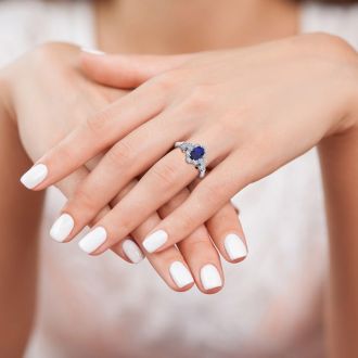 1 Carat Oval Shape Sapphire and Halo Diamond Vintage Ring In 1.4 Karat Gold™