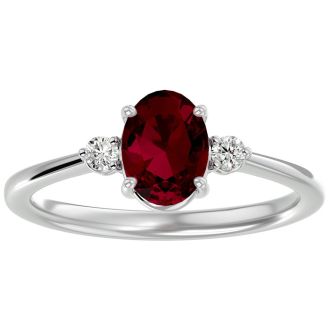 Ruby Ring: 1 1/3 Carat Oval Shape Created Ruby and Two Diamond Ring In Sterling Silver