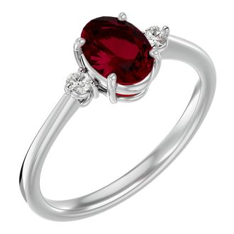 Ruby Ring: 1 1/3 Carat Oval Shape Created Ruby and Two Diamond Ring In Sterling Silver