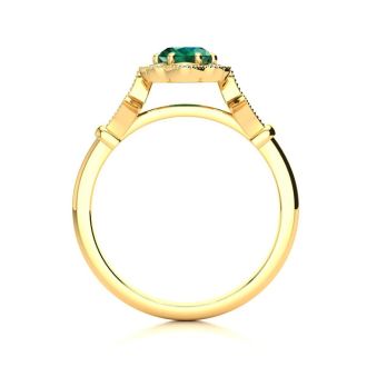 1 Carat Oval Shape Emerald and Halo Diamond Vintage Ring In 14 Karat Yellow Gold