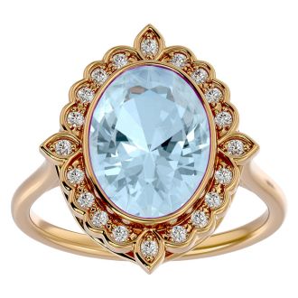 Aquamarine Ring: Aquamarine Jewelry: 1 1/3 Carat Oval Shape Aquamarine and Halo Diamond Ring In 14 Karat Yellow Gold