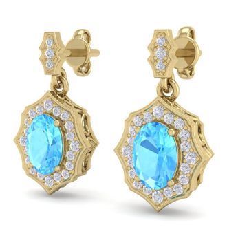 2 1/4 Carat Oval Shape Blue Topaz and Diamond Dangle Earrings In 14 Karat Yellow Gold