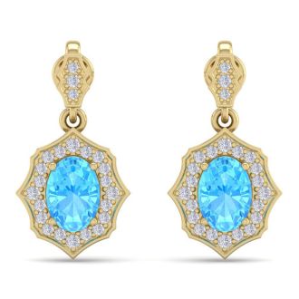 2 1/4 Carat Oval Shape Blue Topaz and Diamond Dangle Earrings In 14 Karat Yellow Gold