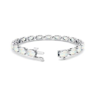 Opal Bracelet With 6 Carats of Oval Shape Opals and Diamonds In 14 Karat White Gold, 7 Inches
