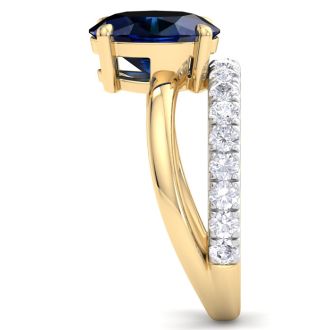 3.60 Carat Oval Shape Sapphire and Halo Diamond Ring Plus Band In 14 Karat Yellow Gold