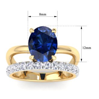 3.60 Carat Oval Shape Sapphire and Halo Diamond Ring Plus Band In 14 Karat Yellow Gold