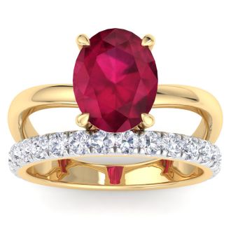 3.60 Carat Oval Shape Ruby and Halo Diamond Ring Plus Band In 14 Karat Yellow Gold