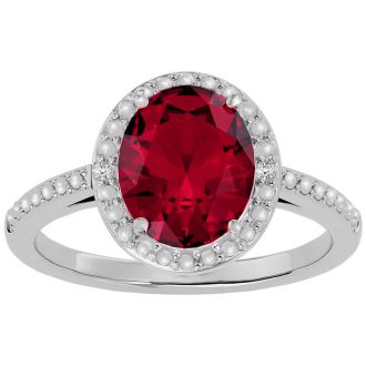 3 ½ Carat Ruby and Diamond Halo Ring created in platinum overlay
