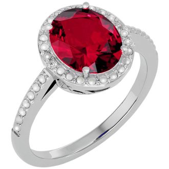 3 ½ Carat Ruby and Diamond Halo Ring created in platinum overlay
