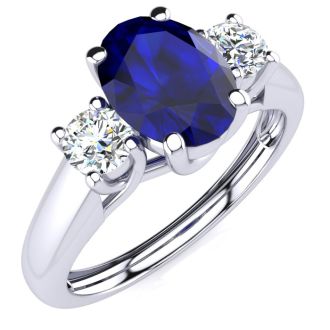 1 1/5 Carat Oval Shape Sapphire and Two Diamond Ring In 14 Karat White Gold