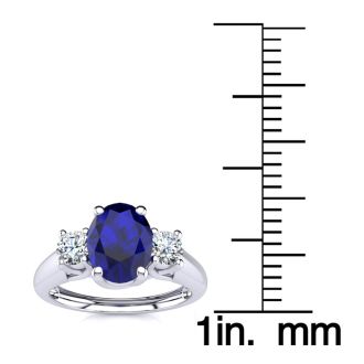 1 1/5 Carat Oval Shape Sapphire and Two Diamond Ring In 14 Karat White Gold