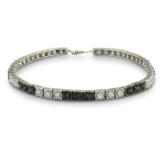 Sterling silver black diamond tennis bracelet with 50 alternating black and white diamonds.  Diamond content is 1 carat in  J/K color I2 clarity.
