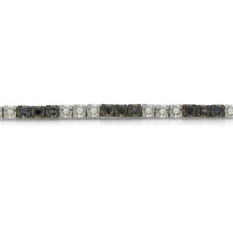 Sterling silver black diamond tennis bracelet with 50 alternating black and white diamonds.  Diamond content is 1 carat in  J/K color I2 clarity.
