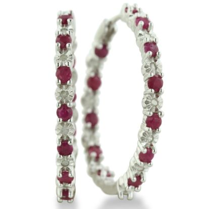 Hoop earrings will always be in style!  Be sure to grab these fabulous ruby and diamond hoop earrings.  Each earring has 12 ruby stones and are set in sterling silver.  Dangling at about 1 inches down, they are perfect for everyone.  Total gem weight is 1.5 carats.  Diamond content is .01 carats, diamond color is J-K and diamond clarity is I2-I3.